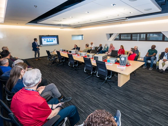 people seated at conference room table