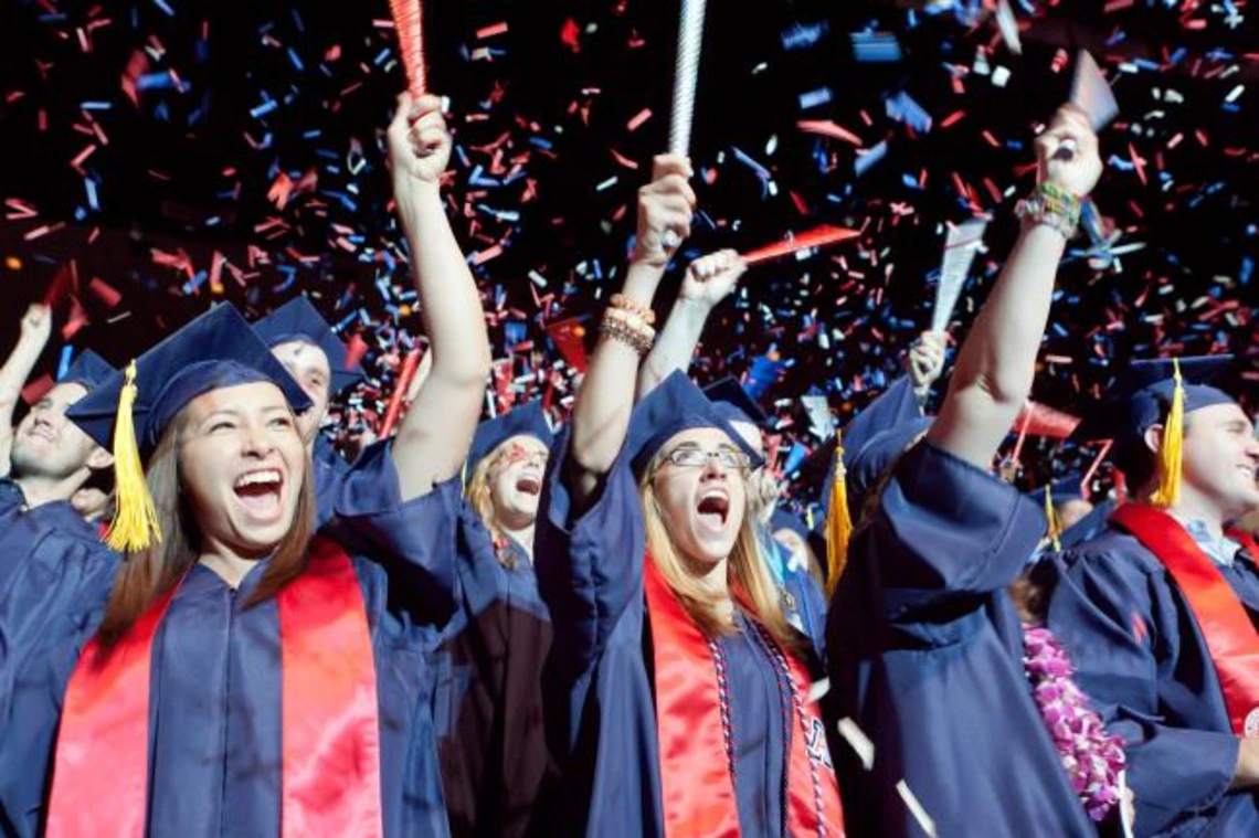 students wearing graduation regallia