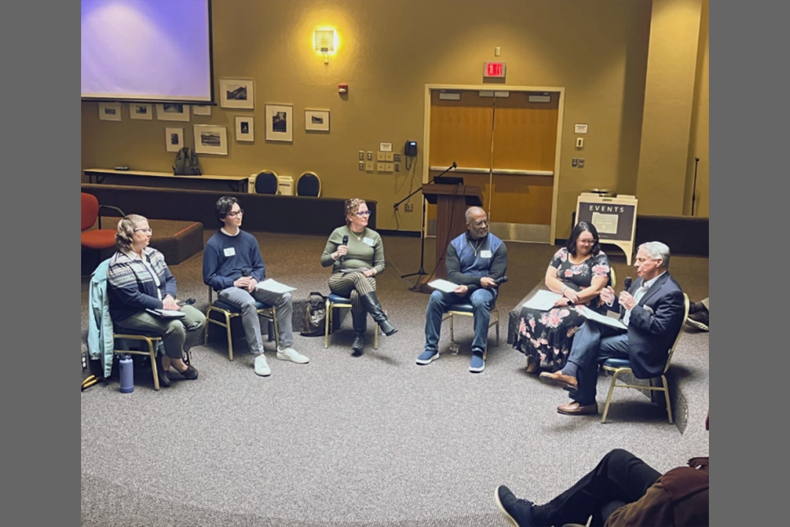 group of people, seated in circle