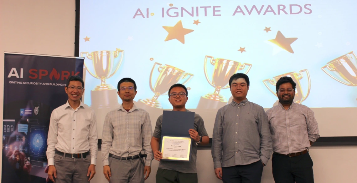 4 faculty present best poster award to phd student