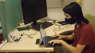 Student programming and debugging an LCD screen