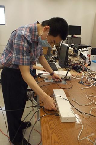 Student working with device to capture wireless signals