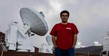 Electrical engineering doctoral student Arash Roshanineshat at the Submillimeter Array, an array of eight 6-meter telescopes in Mauna Kea, Hawaii. 
