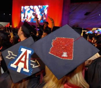 Two graduation caps, decorated w/UA logo and state of AZ