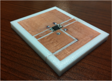 In one line of research, Hao Xin's team is developing 3-D printing solutions to the challenges of combining different materials, as in this coplanar waveguide, a device that is used to transmit microwave-frequency signals.