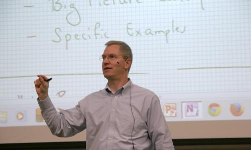 Hal Tharp leads a classroom discussion