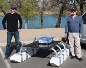 Wolfgang Fink, right, and his ECE grad student Alex Jacobs, prepare to launch TEX II for a series of tests on a lake near Tucson, Ariz.