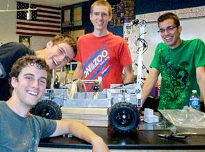 The XSV rover and some team members, from left to right: Lane Ellwood, Jesse Odle, Jordan Odle and Brandon Pitts.